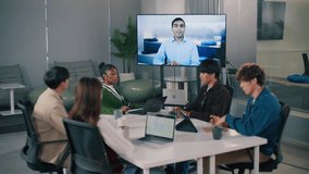 Diverse company employees having online business conference video call, corporate training concept. Business Meeting Video conference in a modern office, virtual connection. Leader is talking Webinar - Powered by Shutterstock - Get 15% off with code: PIKWIZARD15