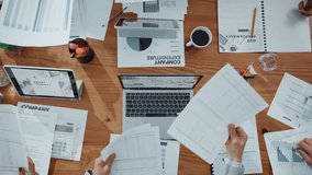 Hands, people and giving documents in office for accounting, finance report and company funds. Staff, team and above with paperwork for timelapse, financial statement and tax compliance information - Powered by Shutterstock - Get 15% off with code: PIKWIZARD15