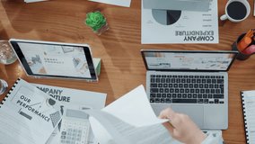 Hands, people and meeting with documents in office for accounting, finance report and company funds. Above, team and giving paperwork to staff, financial statement and information for tax compliance - Powered by Shutterstock - Get 15% off with code: PIKWIZARD15