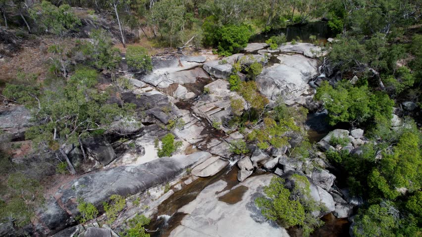 Rocky creek bed at davies creek falls in dinden national park, aerial view