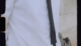 Businessman buttoning jacket and walking in city - Powered by Shutterstock - Get 15% off with code: PIKWIZARD15