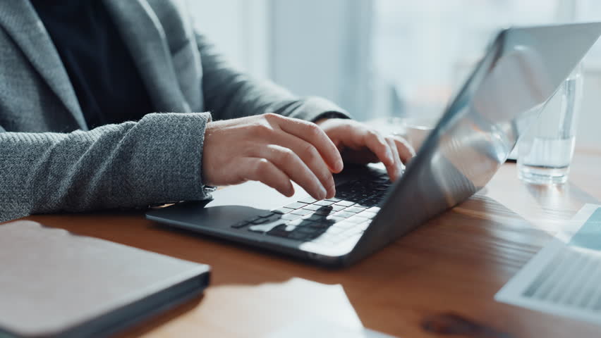Finance, businessman and hands typing on laptop for account management or online report. Office, keyboard or accountant with technology for taxes compliance, investment project or auditing budget
