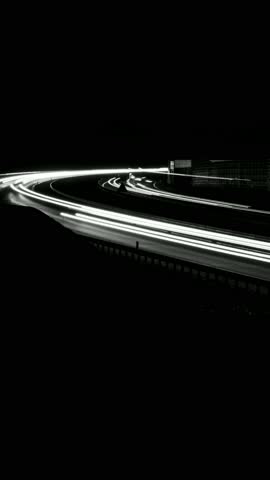 white lines of car lights on black background