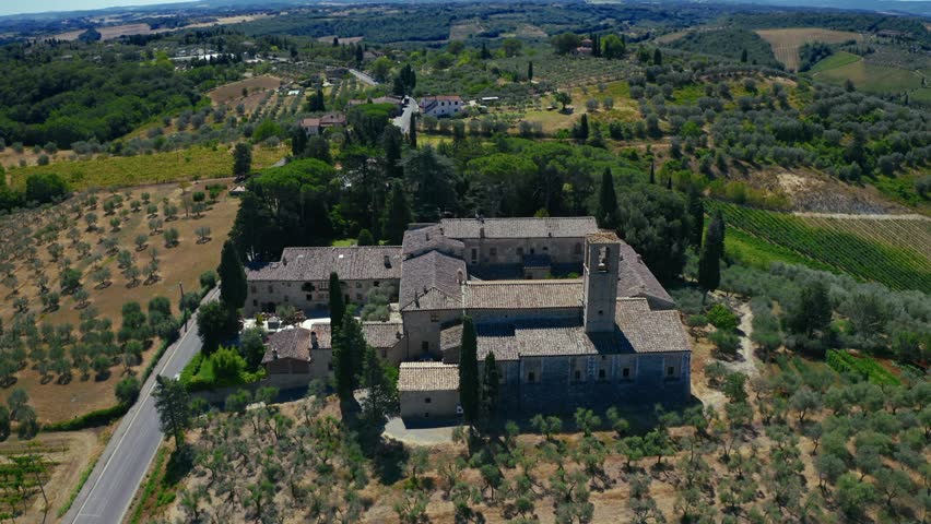 Aerial view of the medieval complex of the abbey of monte oliveto maggiore near san gimignano, tuscany