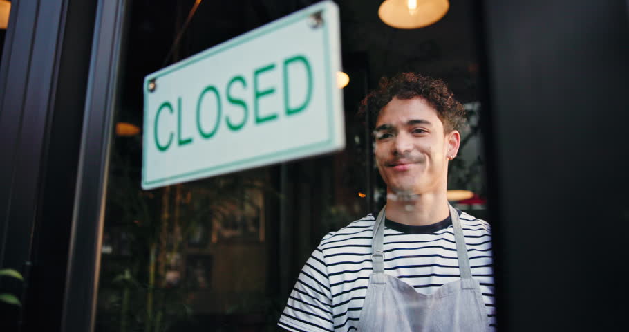 Small business, entrance and man in cafe, open sign and waiter with friendly service. Person, thinking and employee with billboard, retail storefront and restaurant with customer welcome or start day