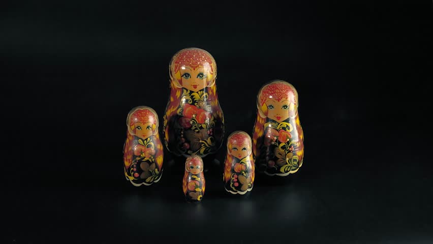 Group of Matryoshka dolls isolated on a black background. Group of Russian Nesting Dolls on a black background. 