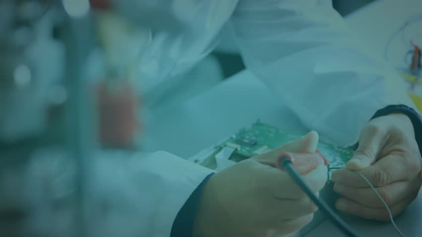 Electronics technician soldering wires onto circuit board, animating network nodes on hands. Technology, innovation, precision, connectivity, engineering, digital, analytics - Powered by Shutterstock - Get 15% off with code: PIKWIZARD15