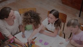 Teacher guiding students drawing and passing markers with math calculator icon animating labels. Classroom, education, teamwork, creativity, learning, collaboration, youthful - Powered by Shutterstock - Get 15% off with code: PIKWIZARD15