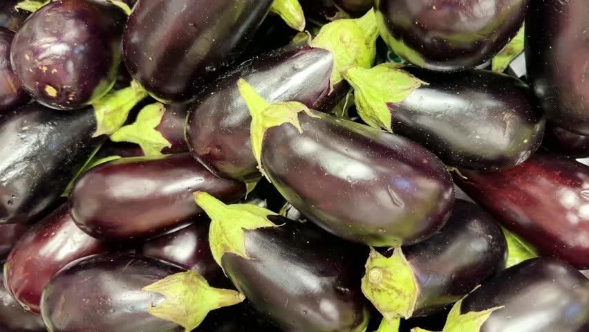 buying vegetables(eggplant, zucchini,) at the market