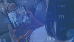 Man tapping tablet on couch, revealing live call with finance line graph and bar chart rising. Technology, communication, collaboration, analytics, data visualization, remote work, digital - Powered by Shutterstock - Get 15% off with code: PIKWIZARD15