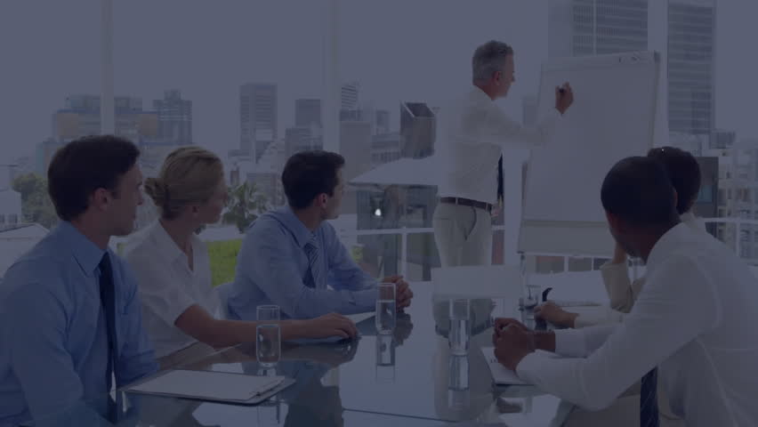Presenter writing Profit Success at board starting avatars linking into network over business table. Corporate, teamwork, leadership, innovation, collaboration, technology, strategy