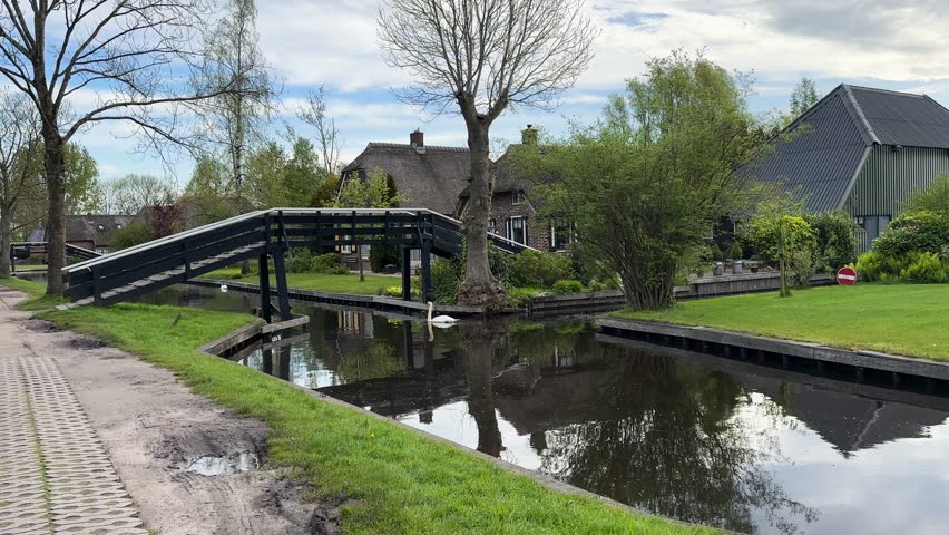 rural dutch traditional country small old town Giethoorn with canals and boats, Netherlands