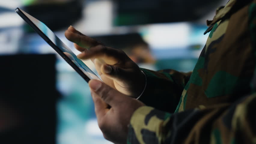 African american army staff monitoring drone and satellite imagery to collect information, finding enemy position helpful for war planning. National defense mission operations. Camera B.