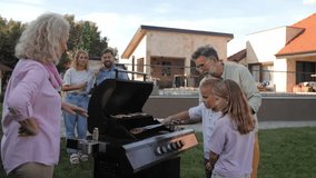 Multigenerational family bonding while grandfather teaching grilling techniques to granddaughter in sunny backyard, family members watching closely - Powered by Shutterstock - Get 15% off with code: PIKWIZARD15