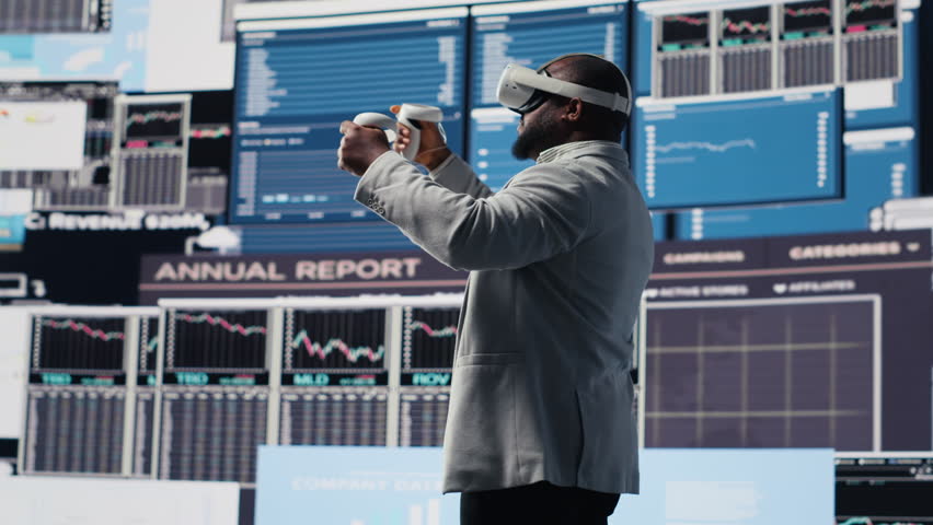 Young startup administrator reviews big data with virtual reality headset, working hard on business growth to increase profit. Analyzing monthly reports for productivity and success. Camera B. - Powered by Shutterstock - Get 15% off with code: PIKWIZARD15