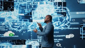 Young black businessman having a conversation on phone call, sharing insight on artificial intelligence systems and machine learning. IT engineer chatting about neural networks. Camera A. - Powered by Shutterstock - Get 15% off with code: PIKWIZARD15