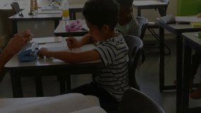 Instructor guiding student pressing embossing key, summoning swirling data flow as teaching letters. Education, mentorship, technology, digital, learning, innovation, classroom - Powered by Shutterstock - Get 15% off with code: PIKWIZARD15