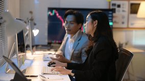 Business people analyzing financial data on computer screen, working late in office - Powered by Shutterstock - Get 15% off with code: PIKWIZARD15