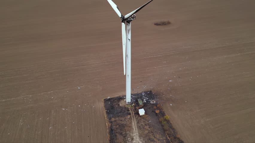 Close up footage of a burned down wind turbine generator. Lightning strike of windmill or overheating caused meltdown of power generator engine and mechanical system. Destroyed infrastructure Disaster