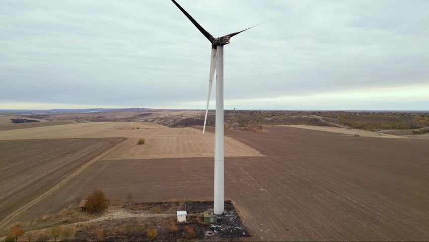 Close up footage of a burned down wind turbine generator. Lightning strike of windmill or overheating caused meltdown of power generator engine and mechanical system. Destroyed infrastructure Disaster