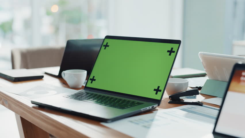 Laptop, green screen and accounting in empty office for research, finance report and performance. Mockup space, desktop and management for financial planning, tax information and investment proposal