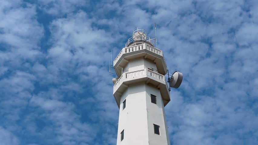 Closeup view looking up at Gili Selang Lighthouse at Easternmost Point of tropical island of Bali, Indonesia