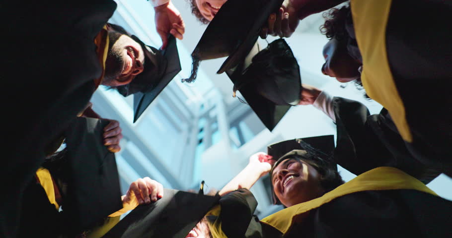 Students, happy and throw hats for graduation, celebration and success with education at college. People, group and goals with cap, scholarship and achievement at university campus from low angle