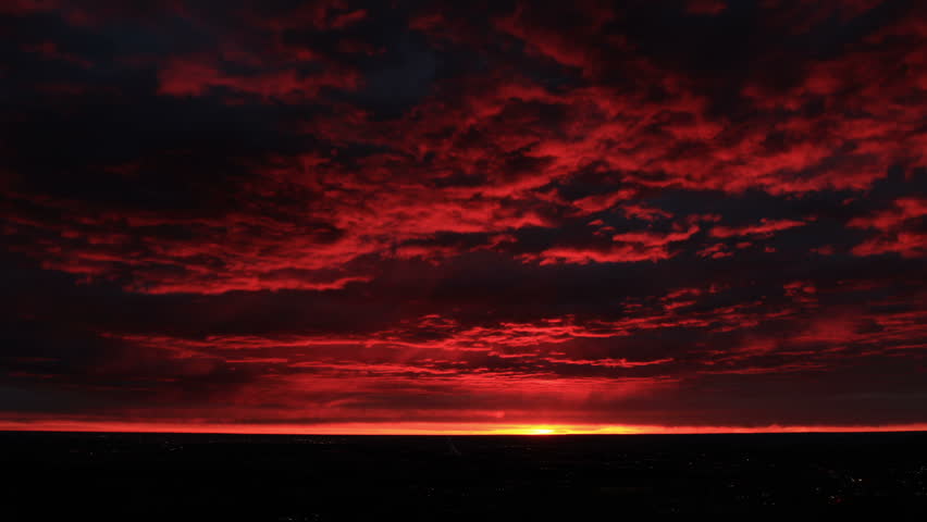 Brilliant Red Sunrise and Storm Clouds over Denver, Colorado. HD 1080p.