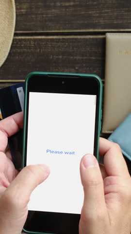 Vertical video. Woman paying for tour. Online payment using smartphone and credit card. Tourism, ordering last minute tour concept.