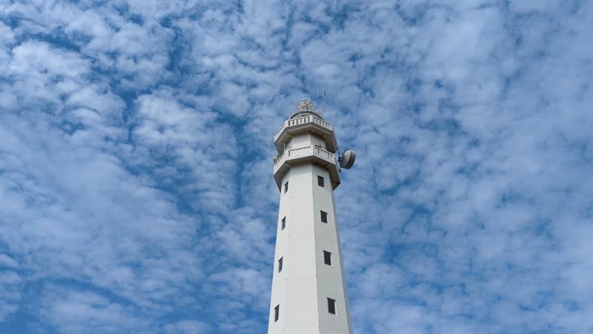 Static view looking up at Gili Selang Lighthouse at Easternmost Point of tropical island of Bali, Indonesia