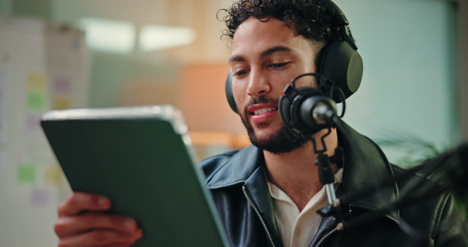 Tablet, podcast and man with mic in studio for hosting, broadcast or interview with online questions. Content creation, live stream and person on digital tech for audio, radio presenter and recording