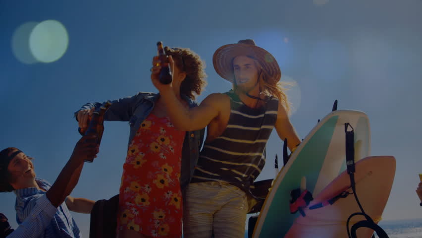 Friends passing beer after parking car with surfboards and raising bottles celebrating travel. Coast, camaraderie, adventure, outdoor, leisure, lifestyle, vibrant
