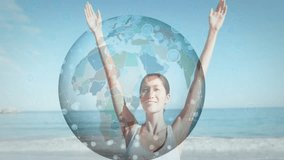 Wellness participant lifting arms at sunny seaside, revealing rotating globe for wellness insight. Health, serenity, connection, harmony, inspiration, mindfulness, innovation - Powered by Shutterstock - Get 15% off with code: PIKWIZARD15