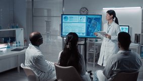 Full shot of cheerful young Chinese female postgraduate student in white coat presenting project on genetics after completing bioengineering course, professor and colleagues clapping and praising work - Powered by Shutterstock - Get 15% off with code: PIKWIZARD15