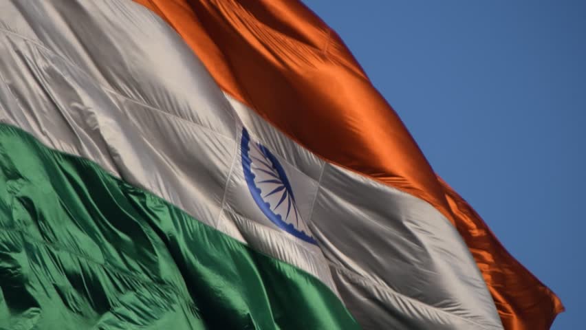 India flag flying high at Connaught Place with pride with plain white background, India flag fluttering, Indian Flag on Independence Day and Republic Day of India, tilt up shot, Har Ghar Tiranga