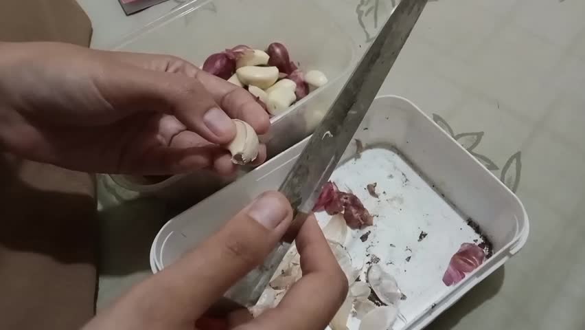 peeling garlic, woman