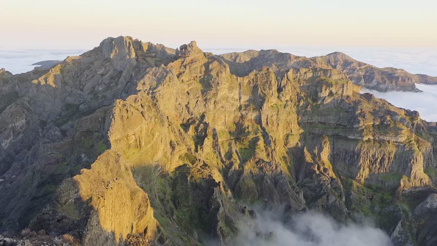 Rocky peaks at Pico Ruivo during sunset in Madeira, Portugal.
