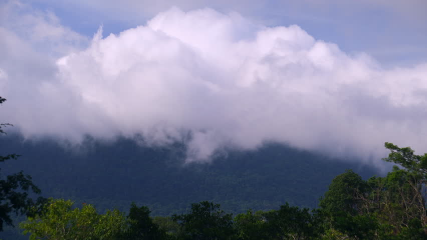 A large number of clouds are floating over the mountaintop in the rainy season morning.