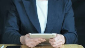 businesswoman uses a tablet to access and download organizational documents through a secure cloud storage system, touching a digital folder icon to retrieve information with cybersecurity and backup  - Powered by Shutterstock - Get 15% off with code: PIKWIZARD15