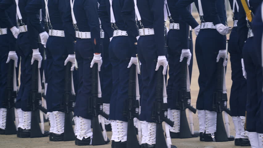 Soldiers marching in parade with their personal weapons