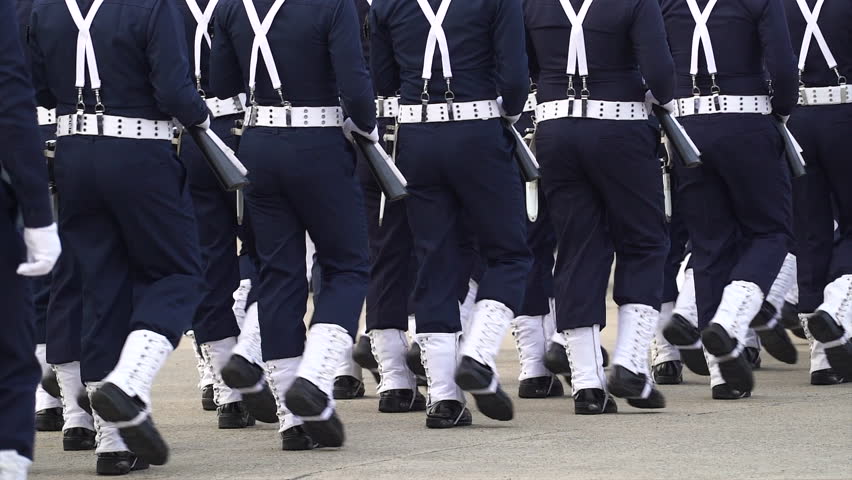 Soldiers marching in parade with their personal weapons