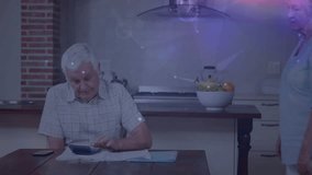 Senior couple calculating bills on calculator, wife touching shoulder and guiding document sorting. Family, retirement, domestic, finance, collaboration, domestic scene, household - Powered by Shutterstock - Get 15% off with code: PIKWIZARD15