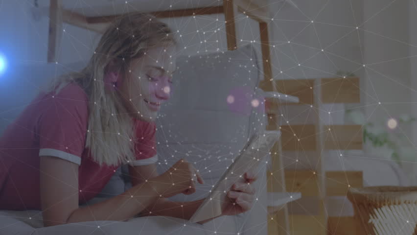 Woman reclining on couch tapping tablet for technology demo with animated network overlay shifting. Futuristic, relaxation, connectivity, digital, casual, modern, interface