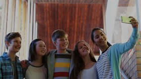 Group of five friends taking selfie initiating social media follower count and icons rising. Group, friendship, social, celebration, engagement, youth, technology - Powered by Shutterstock - Get 15% off with code: PIKWIZARD15