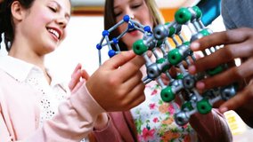 Teen classmates clicking molecular model pieces and causing subscriber counts rising in science lab. Collaboration, innovation, education, creativity, youthful, teamwork, learning - Powered by Shutterstock - Get 15% off with code: PIKWIZARD15