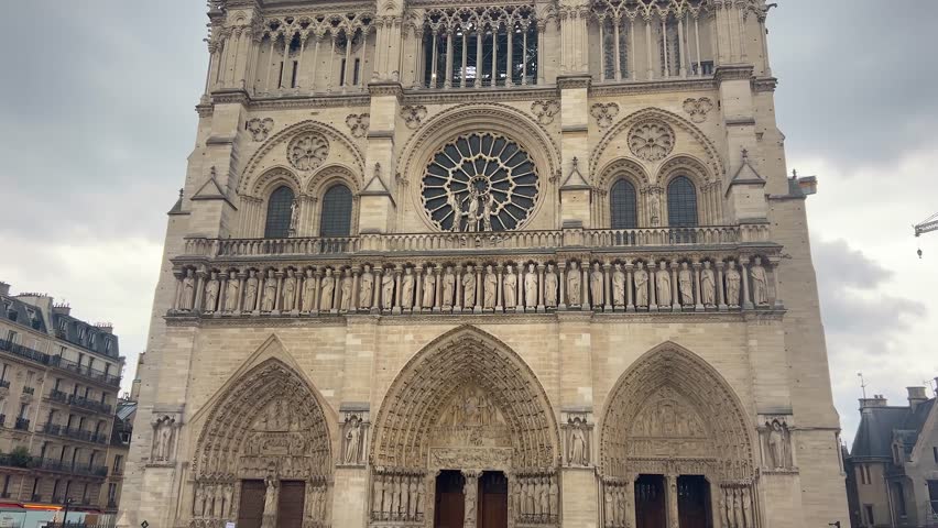 View of the main western facade of the of medieval Catholic cathedral Notre Dame de Paris, Cathedral of Our Lady of Paris, Ile de la Cite, 4th arrondissement of Paris, France.