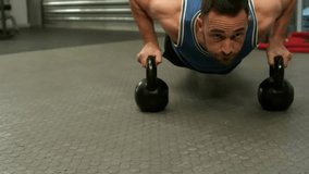 Male athlete performing kettlebell push-up in gym, initiating charts filling with live fitness data. Fitness, strength, data visualization, performance analytics, industrial, training, athleticism - Powered by Shutterstock - Get 15% off with code: PIKWIZARD15
