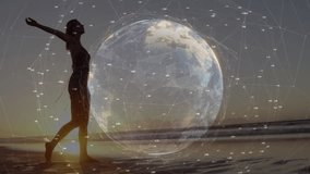 Woman stepping into surf at sunset and walking shore while technology globe pulsing as raising arms. Beach, sunset, technology, digital, connection, horizon, reflection - Powered by Shutterstock - Get 15% off with code: PIKWIZARD15