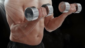 Man performing bicep curls in studio, summoning pin, heart and gauge icons tracking fitness metrics. Gym, fitness, technology, digital, health, workout, biometric - Powered by Shutterstock - Get 15% off with code: PIKWIZARD15
