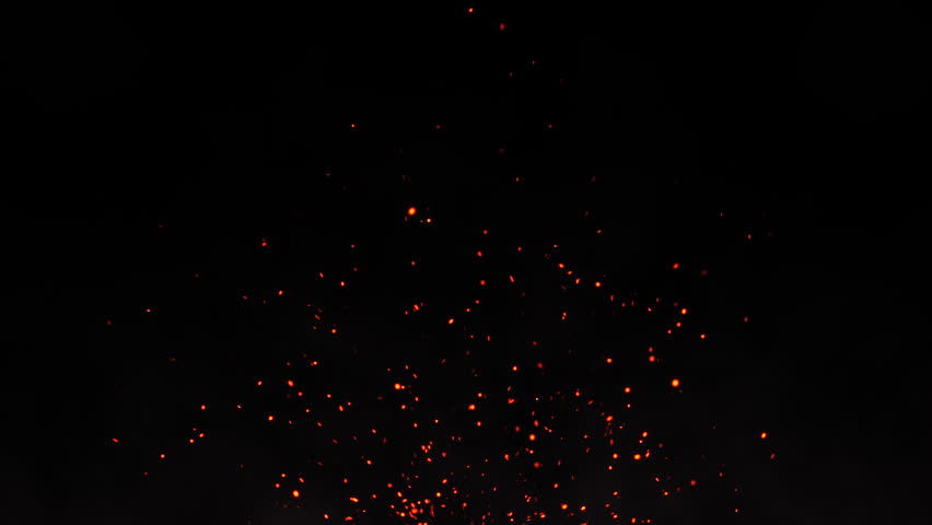Glowing fiery red fire sparks rising with the wind on a night sky. Bright burning fire particles and bonfire embers. Hot fire ashes moving up, heat and haze of a campfire. Fire background. 4k. 